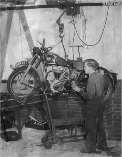 Bike on repair shop hoist pic