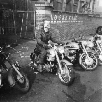 Brian Slark on Norton Twin exiting factory pic